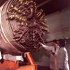 two men inspecting large heat exchanger
