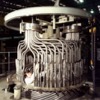 man working inside large boiler
